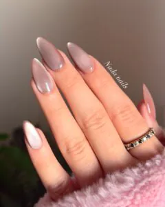 shimmering almond shaped cat eye nails in a soft mauve gel finish.