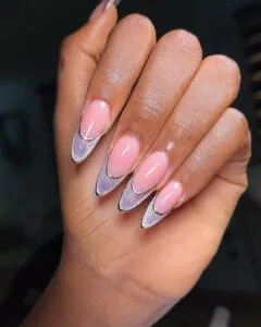 pointed almond nails with purple cat eye french tips and gold outlines.