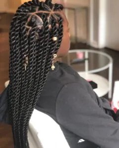 black rope twist braids with gold hair jewelry and triangle parts