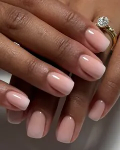 short square bridal nails with soft white and pink ombre and diamond engagement ring.
