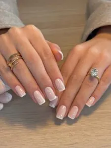 short square french tip nails with a clean nude base and white tips