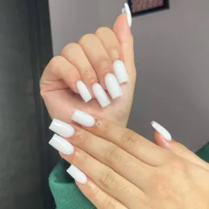 long square milky white nails with high shine finish on both hands.