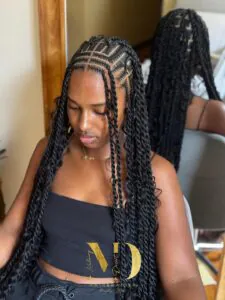 long black island twists with intricate parting and face framing braids