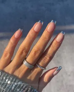 long square silver chrome French tip nails on a nude base with rings