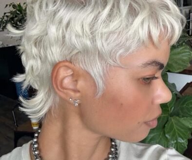 platinum blonde pixie cut with textured layers and side profile view