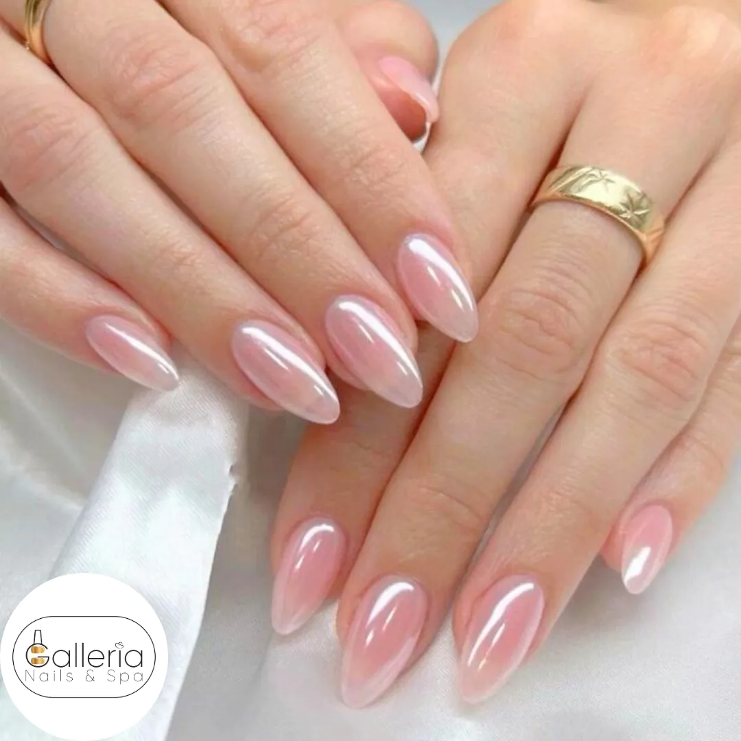 almond shaped nails with a shimmering iridescent pink glazed donut finish
