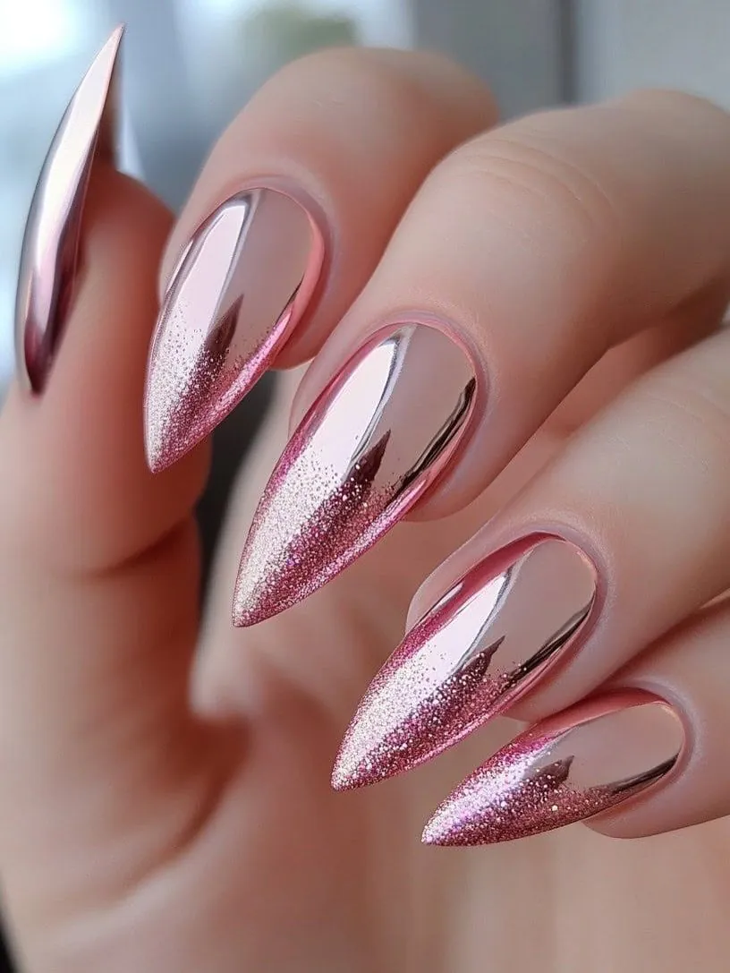 stiletto gel nails with a metallic pink chrome finish and fine glitter accents