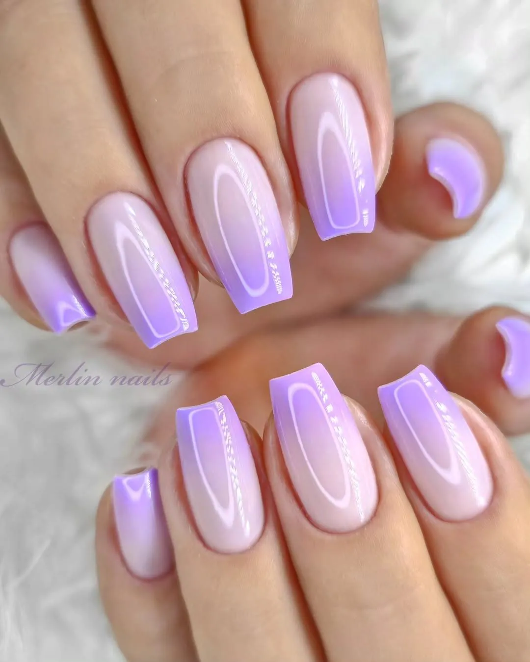 square shaped gel nails featuring a smooth purple and nude ombre gradient pattern