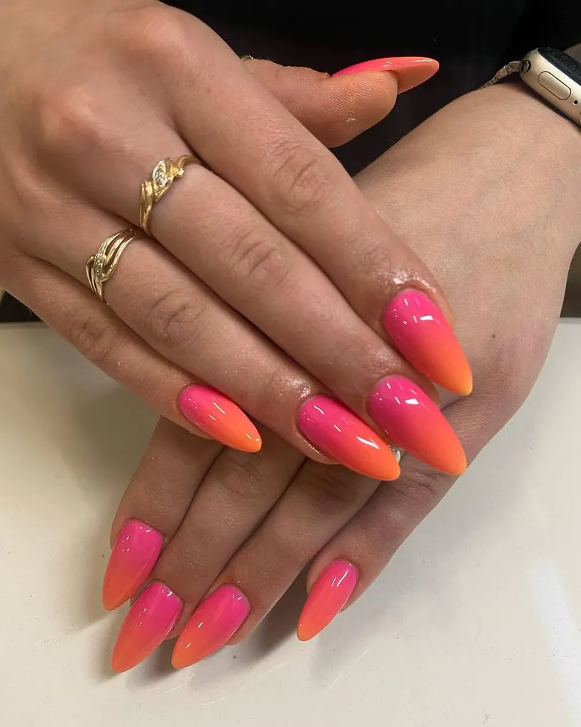 long almond shaped nails with pink and orange ombre manicure art