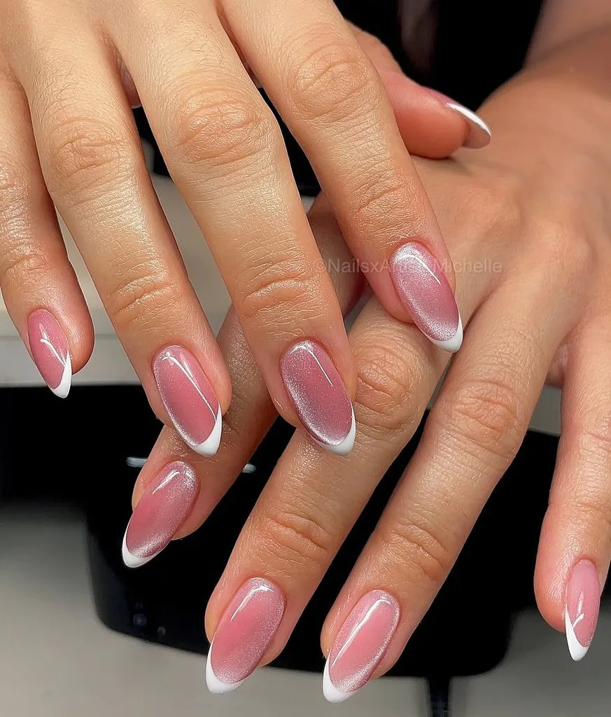 classic white cat eye french tip nails on glossy pink almond base