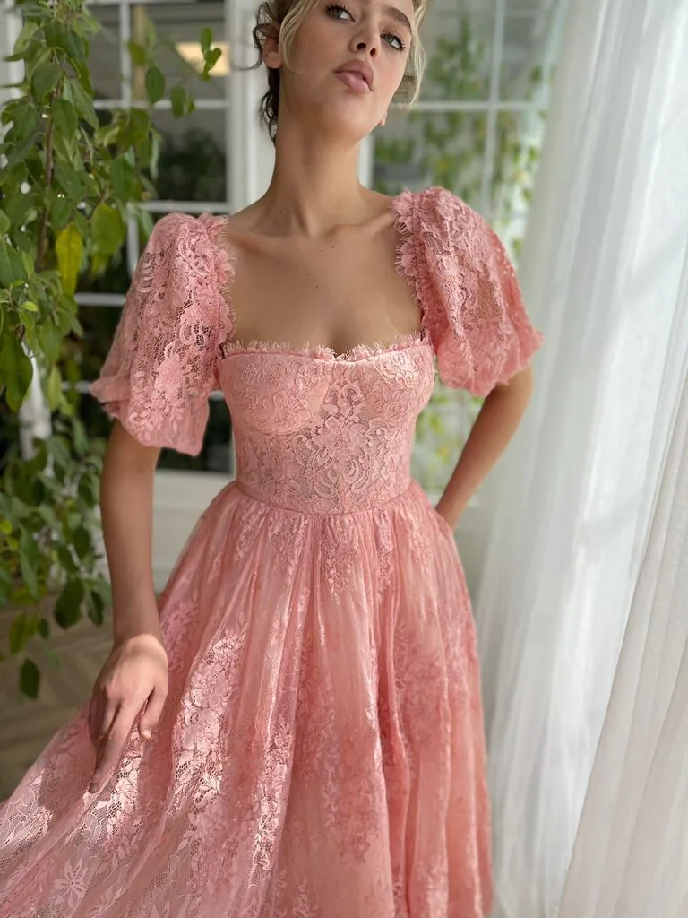 woman wearing a pink lace puff sleeve dress tea party outfit