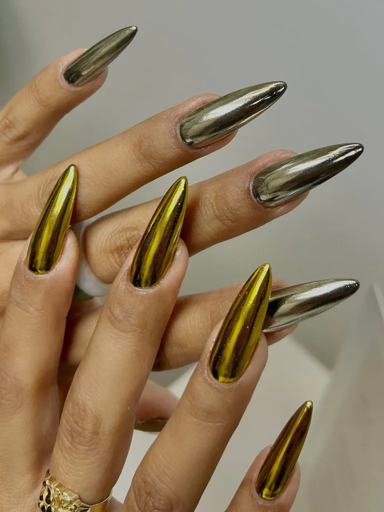 long stiletto nails with mixed metallic gold and silver mirror chrome finishes
