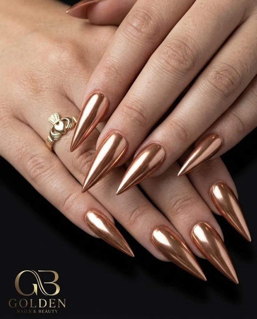 long sharp stiletto nails with metallic rose gold copper chrome finish