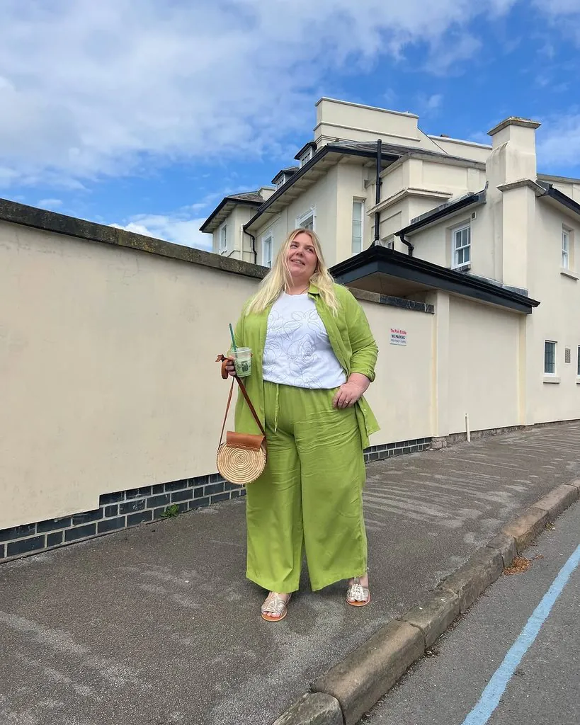plus size woman wearing a lime green matching set on the sidewalk