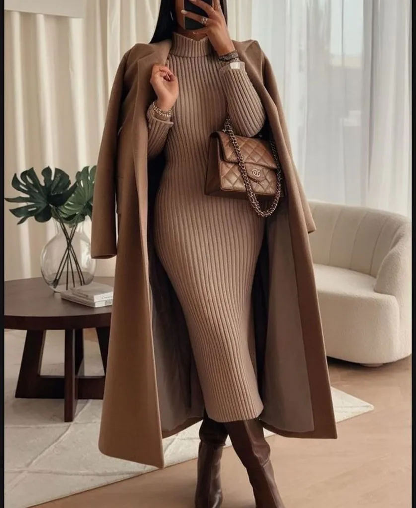 woman wearing beige ribbed dress and matching coat holding quilted purse