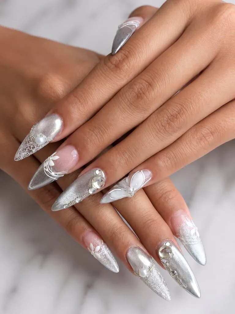 silver stiletto nails with intricate lace patterns and pearl embellishments