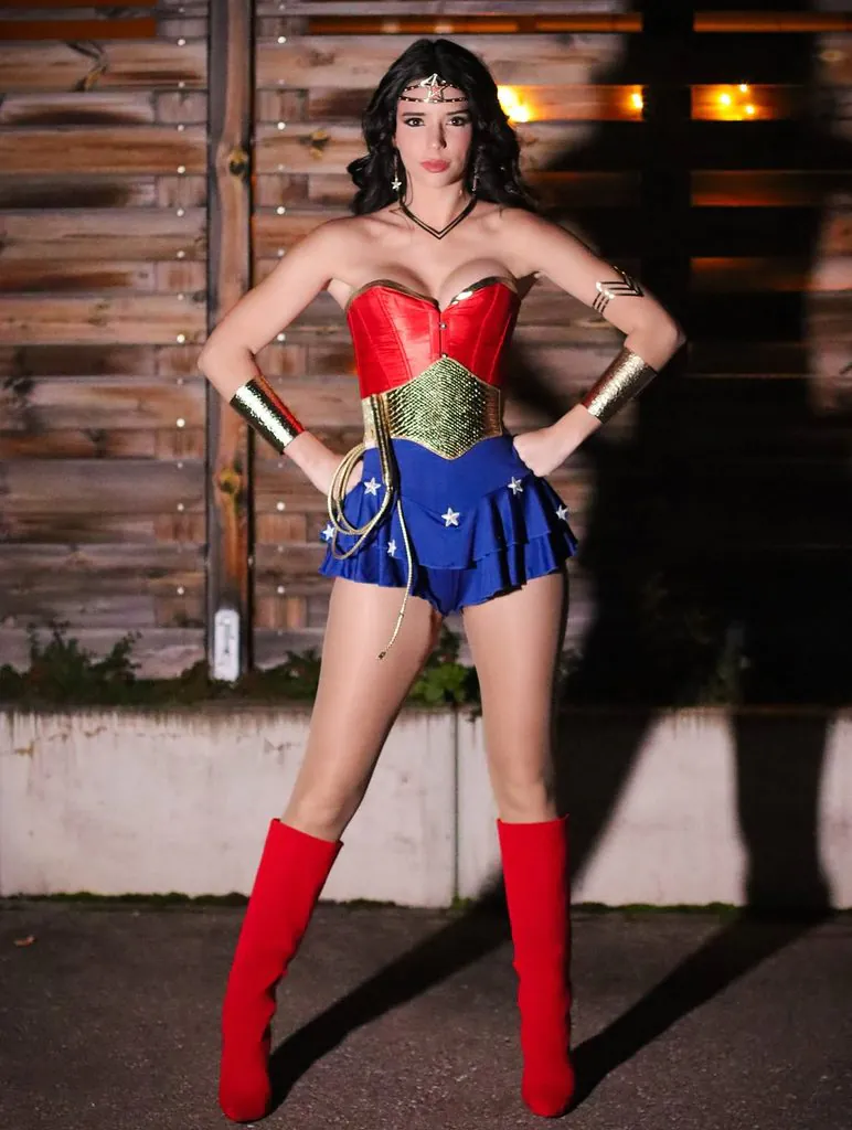 woman dressed in a wonder woman costume with a red corset, blue skirt, and boots
